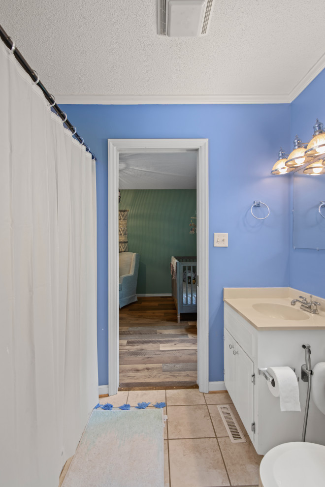 Inspiration for a mid-sized transitional kids' beige floor and single-sink bathroom remodel with shaker cabinets, white cabinets, beige countertops and a built-in vanity