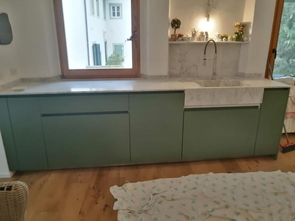 Example of a mid-sized minimalist kitchen design in Florence