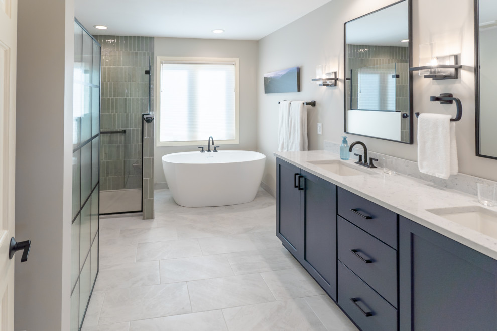 Bathroom - large traditional master ceramic tile, gray floor and double-sink bathroom idea in Milwaukee with recessed-panel cabinets, blue cabinets, a two-piece toilet, gray walls, an undermount sink, quartz countertops, a hinged shower door, white countertops and a built-in vanity