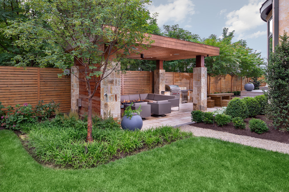 Photo of a contemporary backyard patio in DC Metro with natural stone pavers, an outdoor kitchen and a gazebo/cabana.