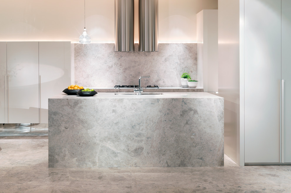 Inspiration for a contemporary galley eat-in kitchen in Melbourne with a drop-in sink, marble benchtops, stone slab splashback, stainless steel appliances, marble floors and with island.