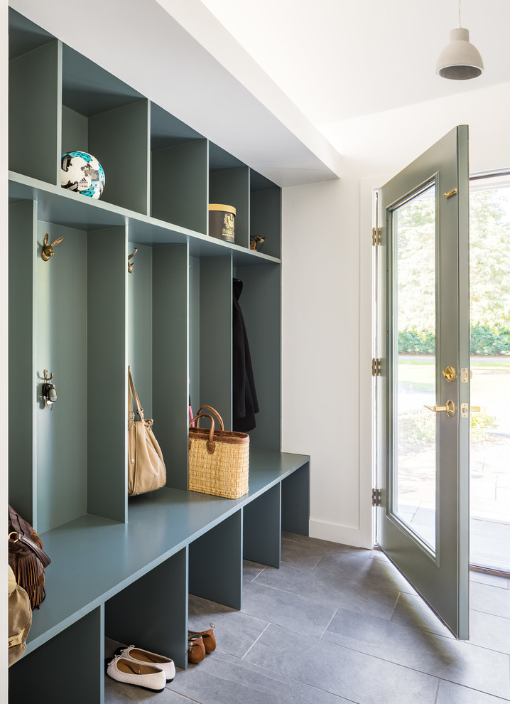 Inspiration for a mid-sized contemporary mudroom in Boston with white walls, slate floors, a single front door, grey floor and a glass front door.