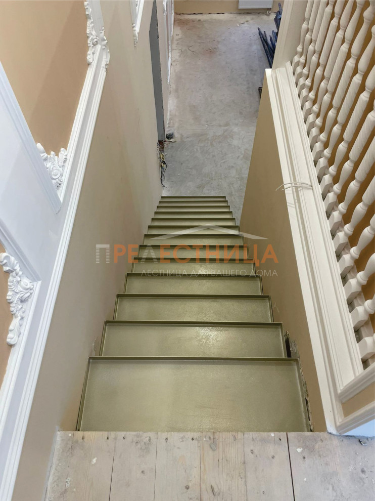 Large tile straight staircase in Other with metal risers.