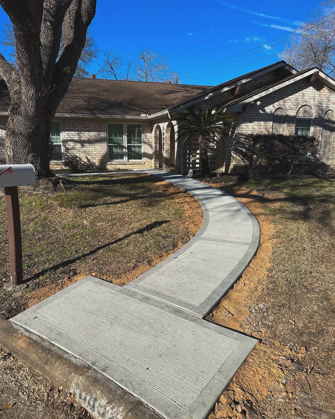 New driveway with sidewalks and stamped concrete!