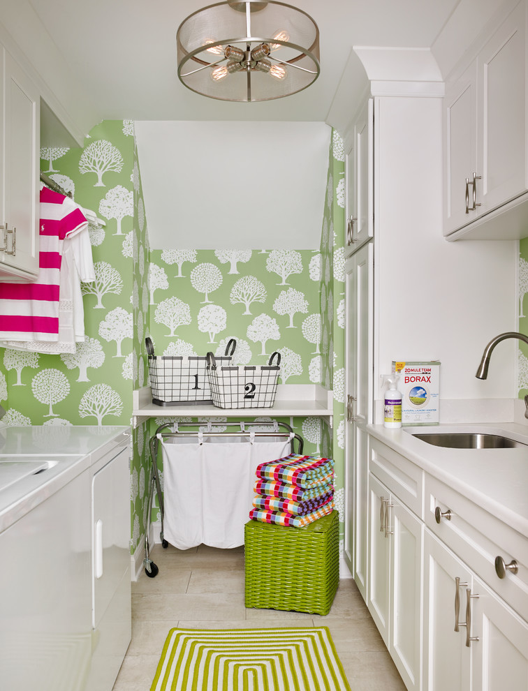 Design ideas for a small transitional galley dedicated laundry room in Atlanta with a single-bowl sink, recessed-panel cabinets, white cabinets, quartz benchtops, green walls, ceramic floors, a side-by-side washer and dryer and white benchtop.