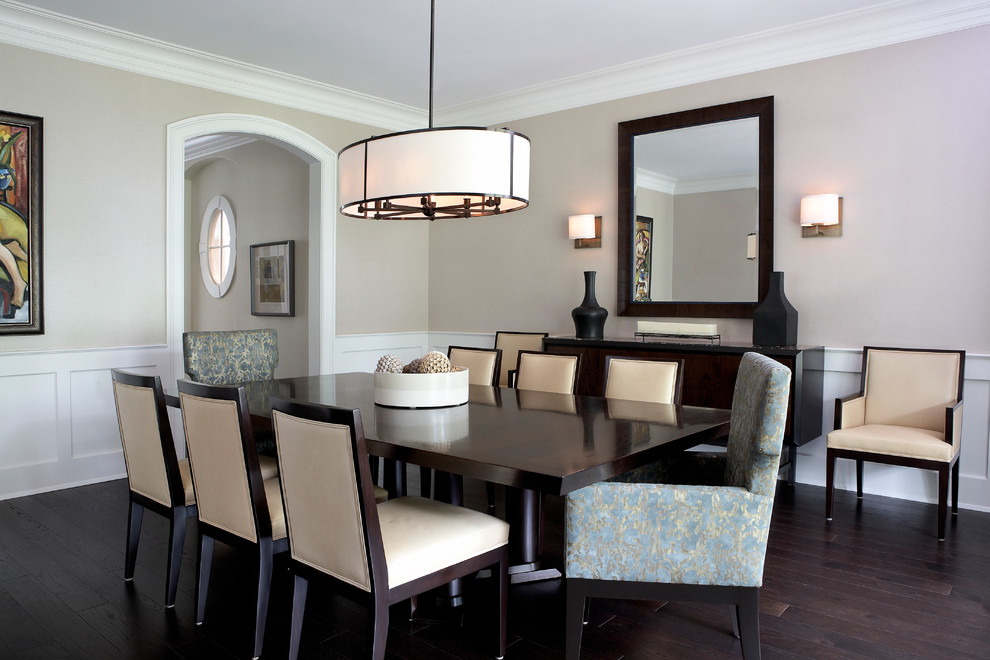 Inspiration for a mid-sized traditional separate dining room in Chicago with beige walls, dark hardwood floors, no fireplace and brown floor.