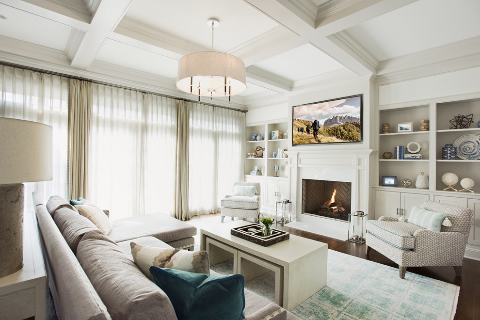 Inspiration for a traditional family room in New York with white walls, a standard fireplace and a wall-mounted tv.