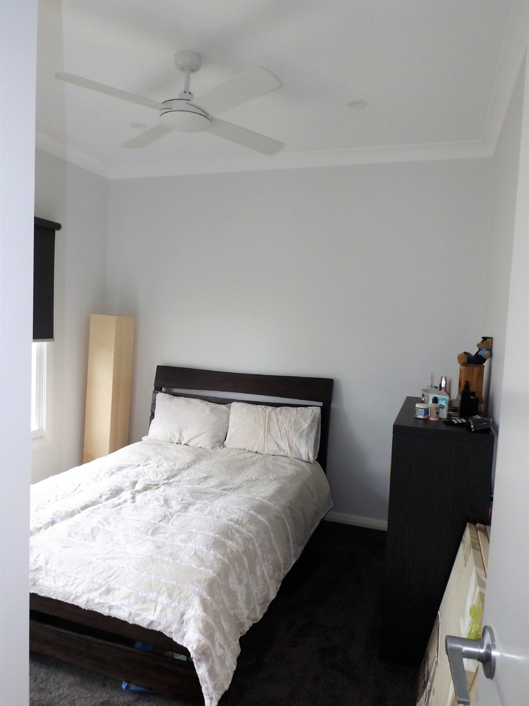 This is an example of a mid-sized modern master bedroom in Central Coast with grey walls and carpet.