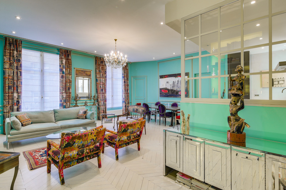 This is an example of a mid-sized eclectic open concept family room in Paris with a home bar, painted wood floors, grey floor, green walls, no fireplace and no tv.