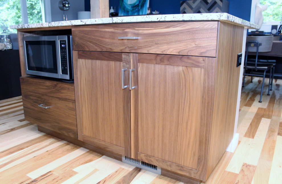 Mid-sized transitional l-shaped kitchen photo with shaker cabinets, dark wood cabinets, ceramic backsplash, stainless steel appliances, an island and multicolored countertops