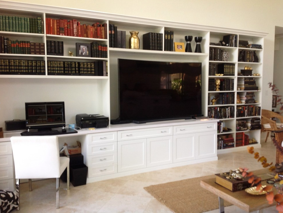 Large transitional home theatre in Los Angeles with white walls, ceramic floors and a built-in media wall.