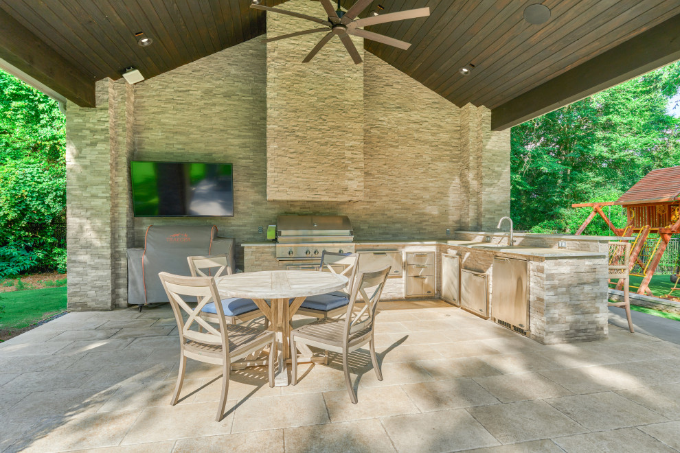 Transitional backyard tile patio kitchen photo in Houston with a gazebo