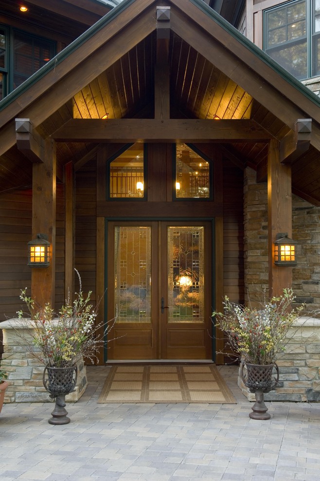 This is an example of a country front door in Minneapolis with a double front door and a glass front door.