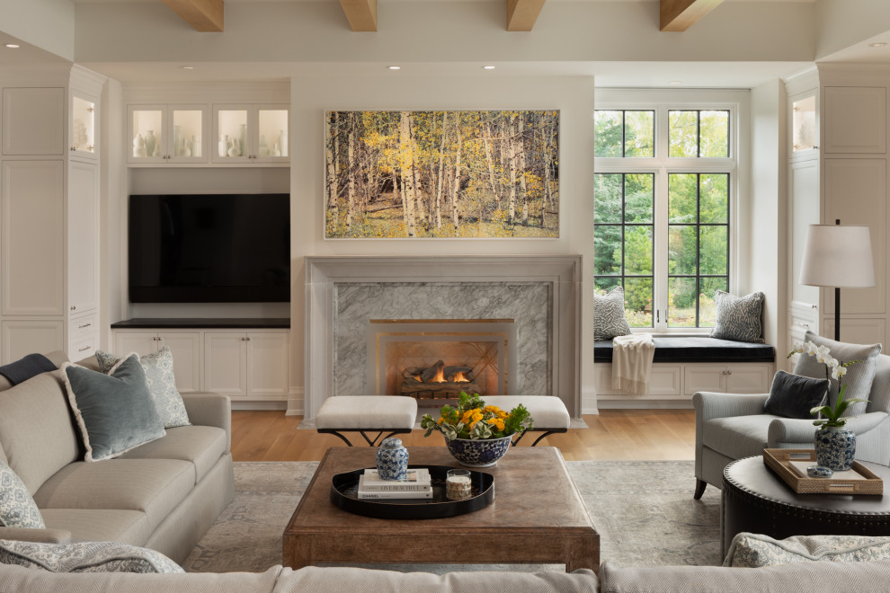 Design ideas for a country formal open concept living room in Milwaukee with white walls, light hardwood floors, a standard fireplace, a stone fireplace surround, a wall-mounted tv, brown floor and exposed beam.