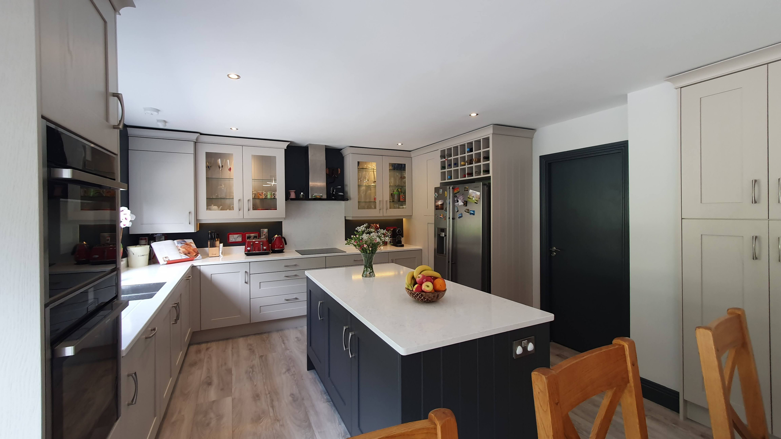 The kitchen and TV room across the back of the property were combined to make one open plan living space. It now contains a large kitchen, dining and sitting area. The space is south east facing and g