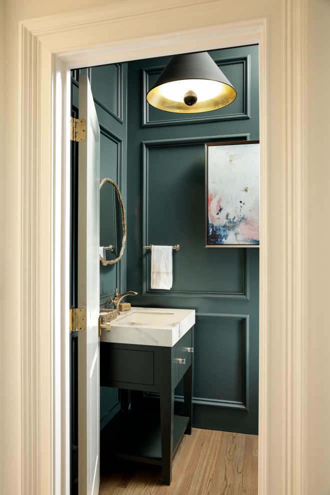 Inspiration for a small classic cloakroom in Atlanta with flat-panel cabinets, grey cabinets, green walls, light hardwood flooring, an integrated sink, marble worktops, brown floors, white worktops, a freestanding vanity unit and wood walls.