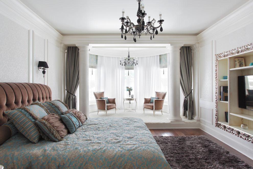 Design ideas for a traditional bedroom in Yekaterinburg with white walls, dark hardwood floors and no fireplace.