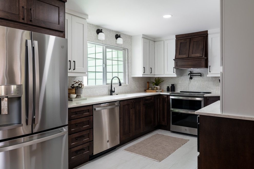 Inspiration for a transitional porcelain tile kitchen remodel in Seattle with an undermount sink, mosaic tile backsplash and stainless steel appliances