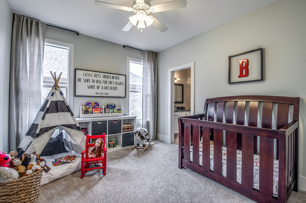 This is an example of a mid-sized transitional gender-neutral nursery in Austin with beige walls, carpet and beige floor.