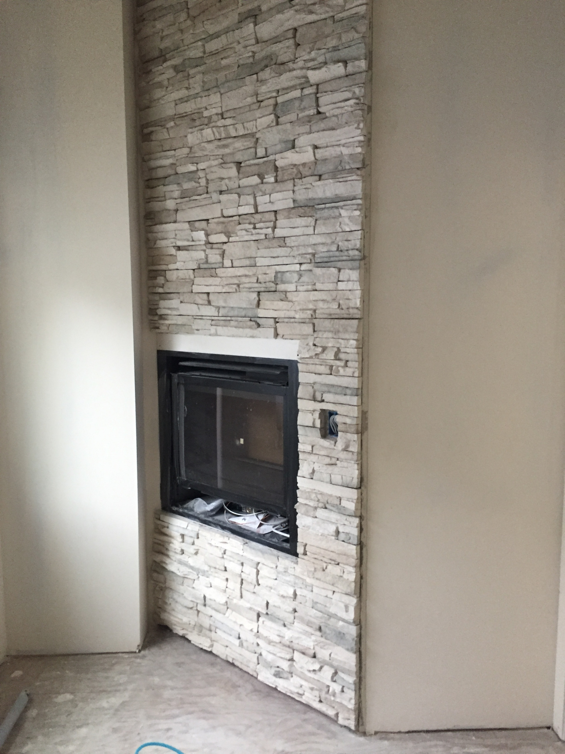 Stone Fireplaces and Wood Mantles