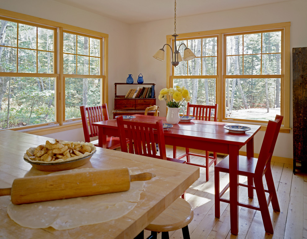 Country kitchen/dining combo in Portland Maine with white walls and medium hardwood floors.
