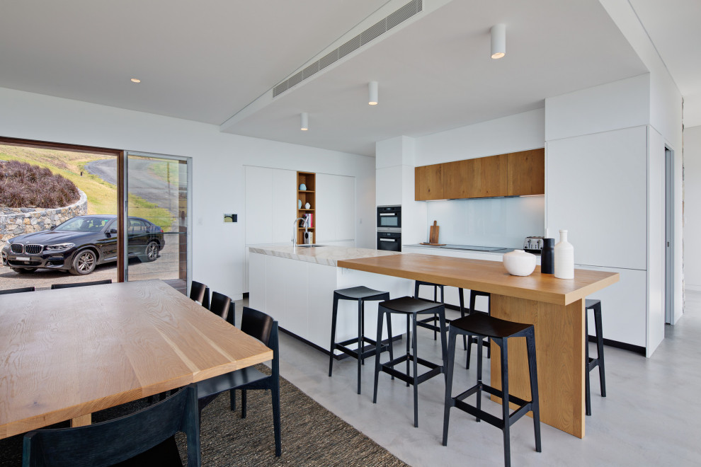 This is an example of a contemporary kitchen in Wollongong with with island.