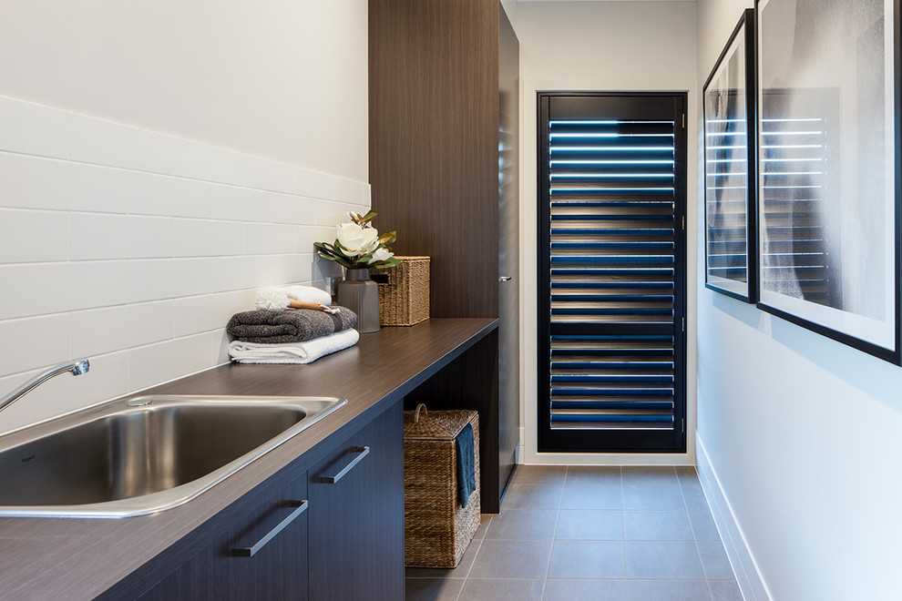 Inspiration for a transitional laundry room in Adelaide.