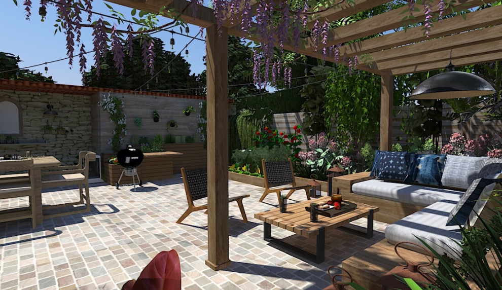 Large rural back patio in Paris with a vegetable patch, natural stone paving and a pergola.