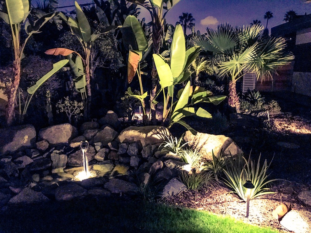 Mid-sized contemporary backyard partial sun formal garden in San Diego with with rock feature and decomposed granite.