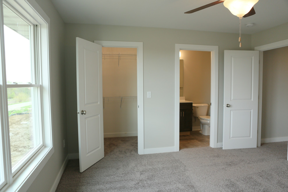 Large transitional guest carpeted home design photo in Chicago with gray walls