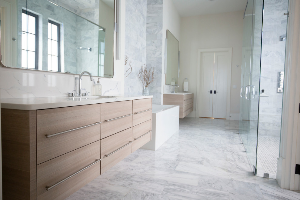 Photo of a large beach style master bathroom in Miami with flat-panel cabinets, light wood cabinets, white tile, stone slab, white walls, marble floors, a drop-in sink, quartzite benchtops, white floor, white benchtops, a double vanity and a floating vanity.