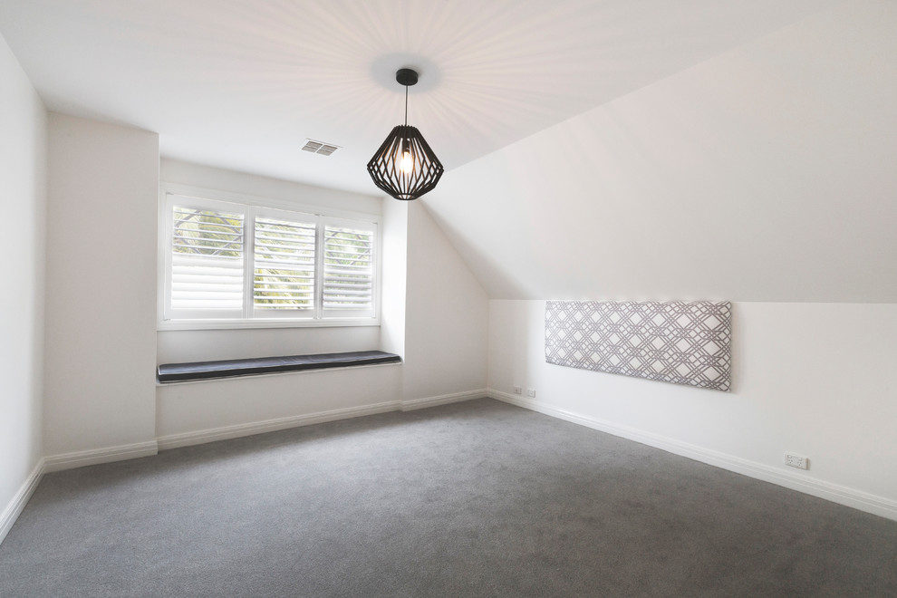 Photo of a mid-sized contemporary bedroom in Melbourne with white walls, carpet and no fireplace.