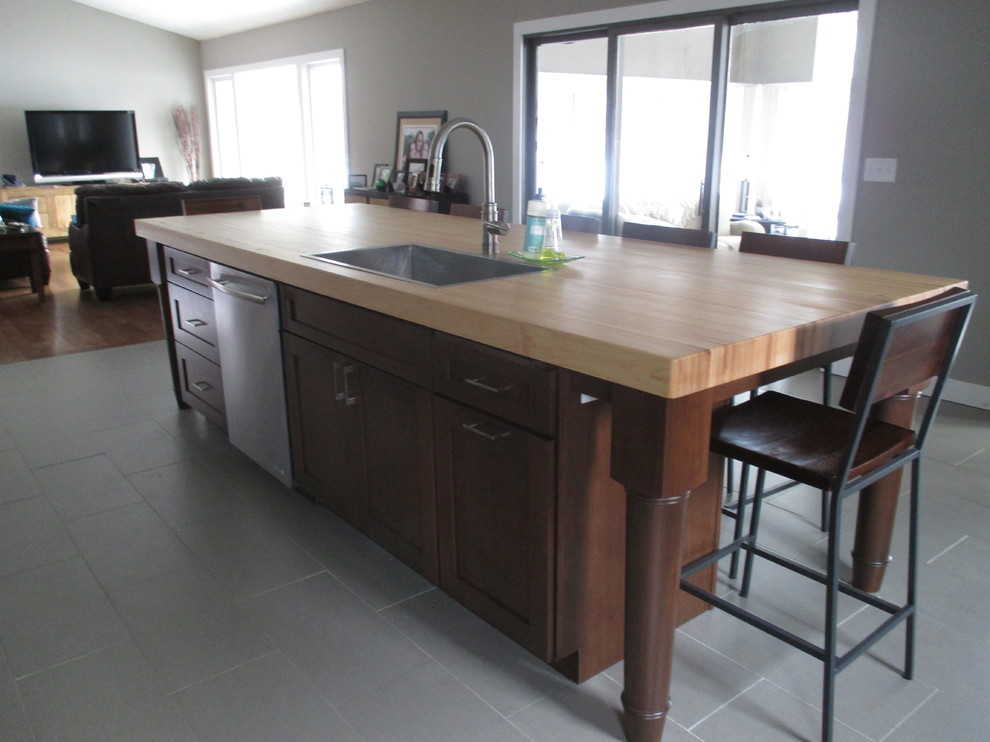 Transitional galley eat-in kitchen photo with shaker cabinets, dark wood cabinets and an island