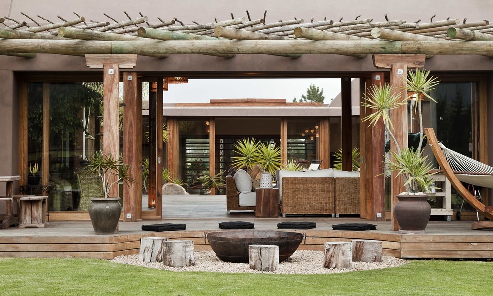 Design ideas for a large contemporary courtyard deck in Other with a pergola.