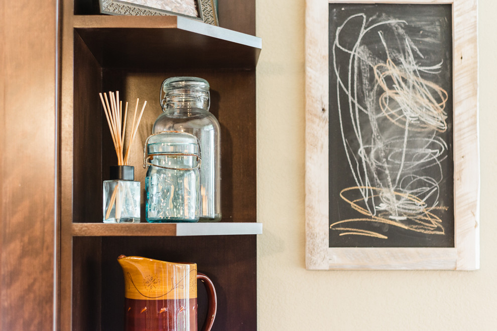 Example of a transitional home design design in Denver