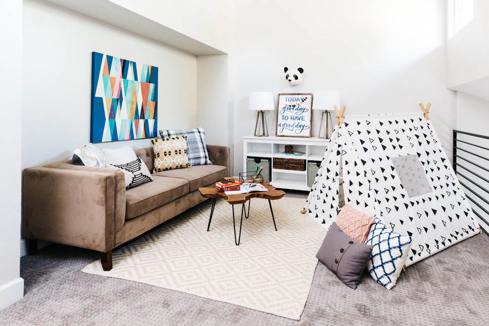 This is an example of a mid-sized transitional gender-neutral kids' playroom for kids 4-10 years old in Phoenix with white walls, carpet and grey floor.