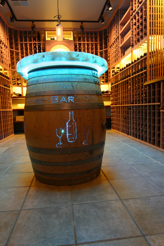 Large traditional wine cellar in Sacramento with ceramic floors, display racks and beige floor.