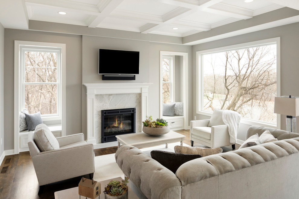 Mid-sized transitional open concept living room in Minneapolis with grey walls, a standard fireplace, a stone fireplace surround, a wall-mounted tv, brown floor and dark hardwood floors.