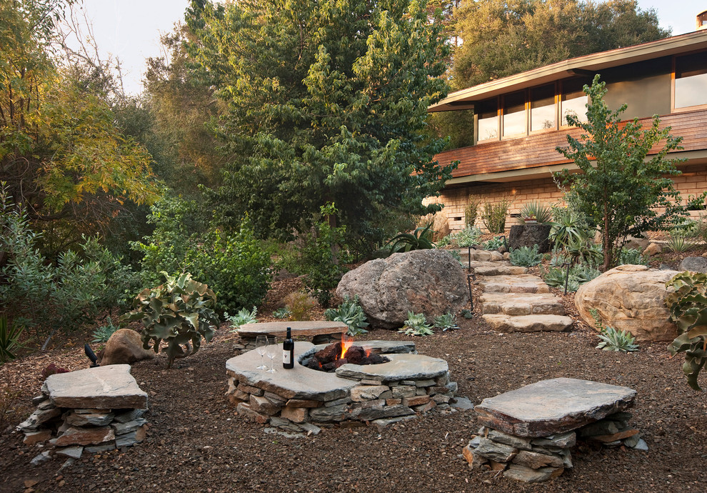 Design ideas for a country garden in Santa Barbara with gravel and with rock feature.