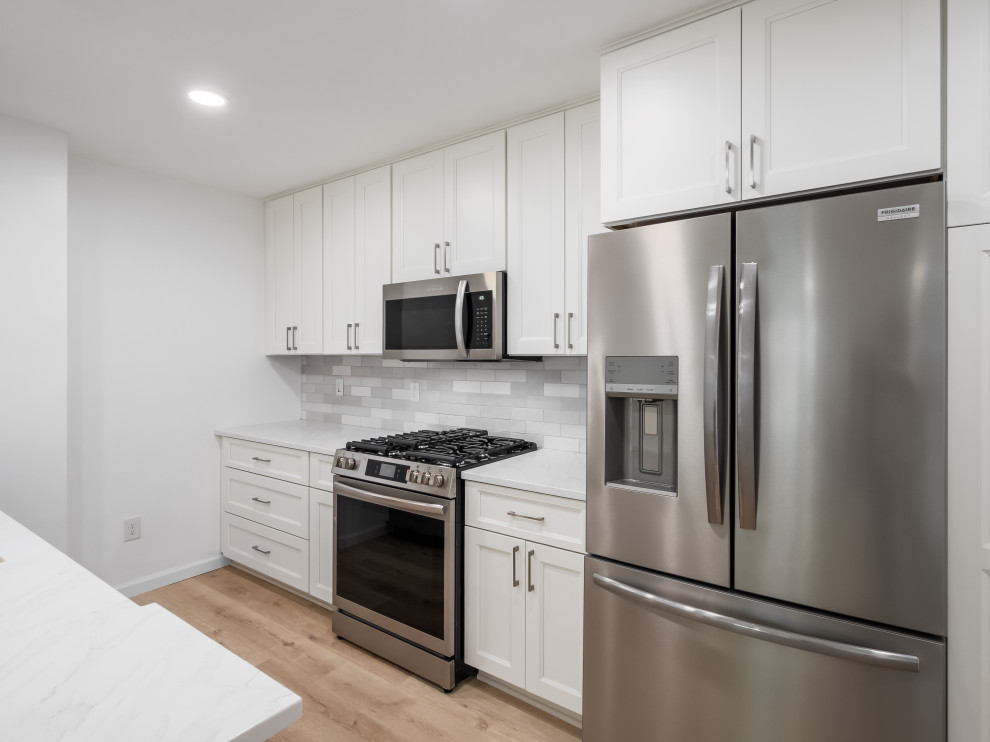 Example of a small transitional galley eat-in kitchen design in Columbus with shaker cabinets, white cabinets, quartz countertops and white countertops