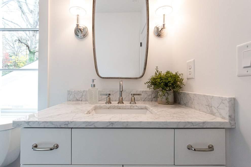 Photo of a small transitional kids bathroom in Atlanta with shaker cabinets, white cabinets, white tile, engineered quartz benchtops, white benchtops, a single vanity and a built-in vanity.