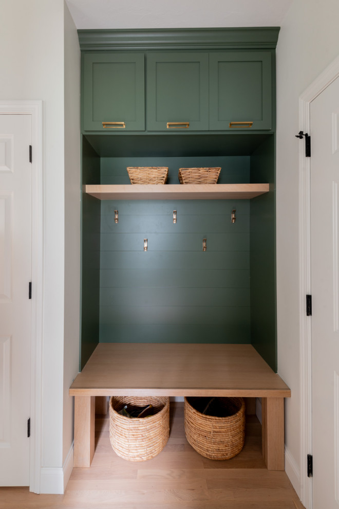 Example of a huge transitional u-shaped light wood floor and beige floor eat-in kitchen design in Boston with an undermount sink, shaker cabinets, white cabinets, quartz countertops, white backsplash, subway tile backsplash, stainless steel appliances, an island and white countertops