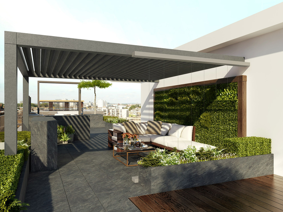 Small contemporary rooftop deck in London with a vertical garden and a pergola.