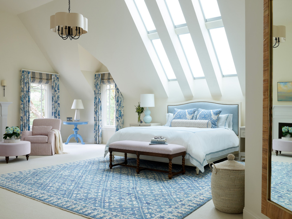 Example of a huge transitional master carpeted and white floor bedroom design in Boston with white walls, a standard fireplace and a stone fireplace