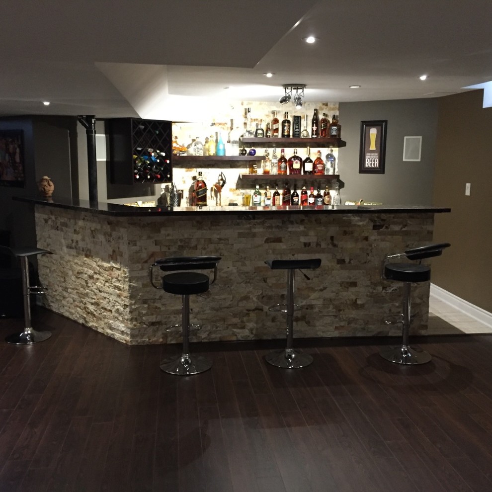Design ideas for a large contemporary galley seated home bar in Other with dark hardwood floors, brown floor, no sink, open cabinets, dark wood cabinets, soapstone benchtops and black benchtop.