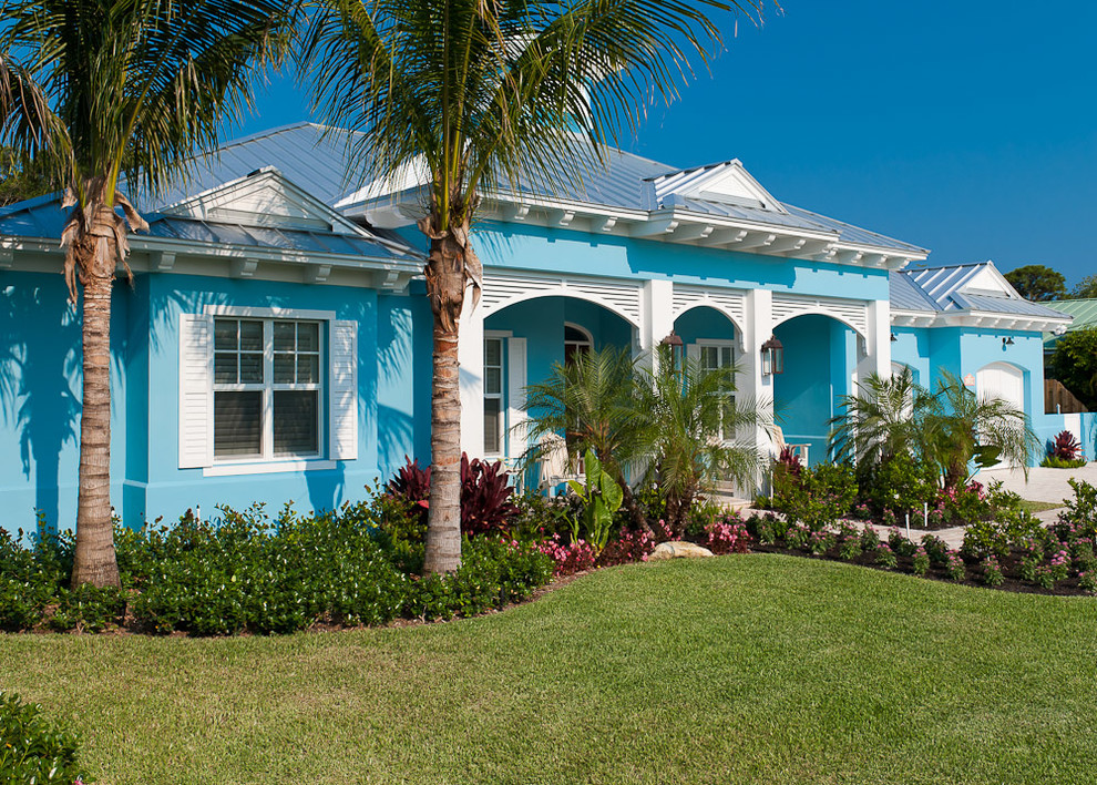 This is an example of a tropical one-storey blue exterior in Miami.