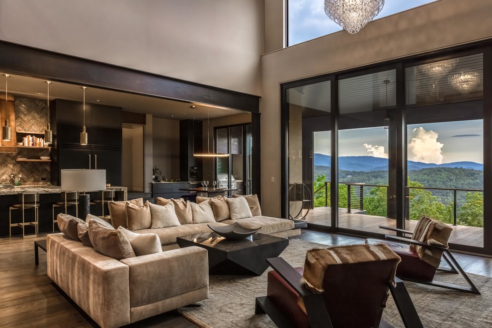Living room - large contemporary open concept dark wood floor and brown floor living room idea in Other with beige walls