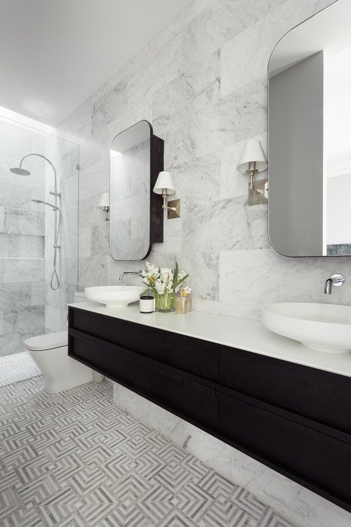 Monochrome Allure: Black Flat-Panel Cabinets and Marble Tile Backsplash for a Sleek Bathroom Vanity