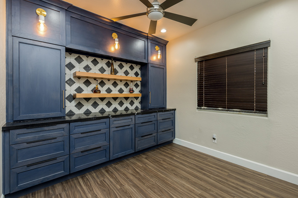 Inspiration for a large modern single-wall dry bar remodel in Phoenix with shaker cabinets, blue cabinets, quartz countertops and black countertops