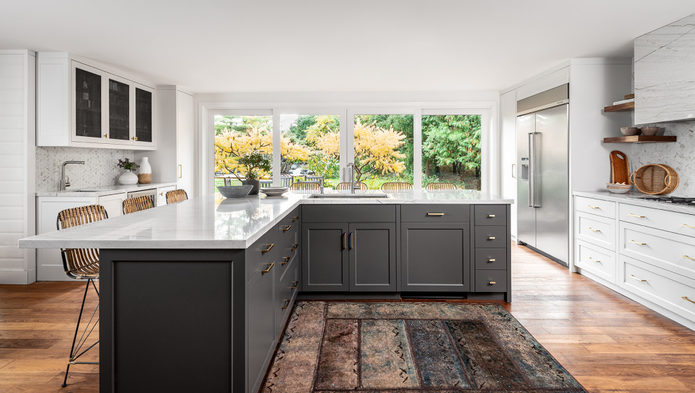 Kitchen - mid-sized rustic medium tone wood floor kitchen idea with a double-bowl sink, recessed-panel cabinets, gray cabinets, quartzite countertops, white backsplash, mosaic tile backsplash, stainless steel appliances, an island and white countertops